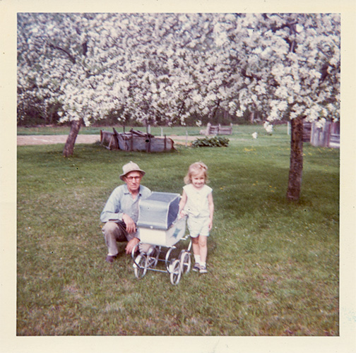 My grandfather and I in spring amidst the apple blossoms