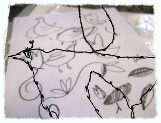 Detail of Stitched Bird On Acetate With Sketches in Background